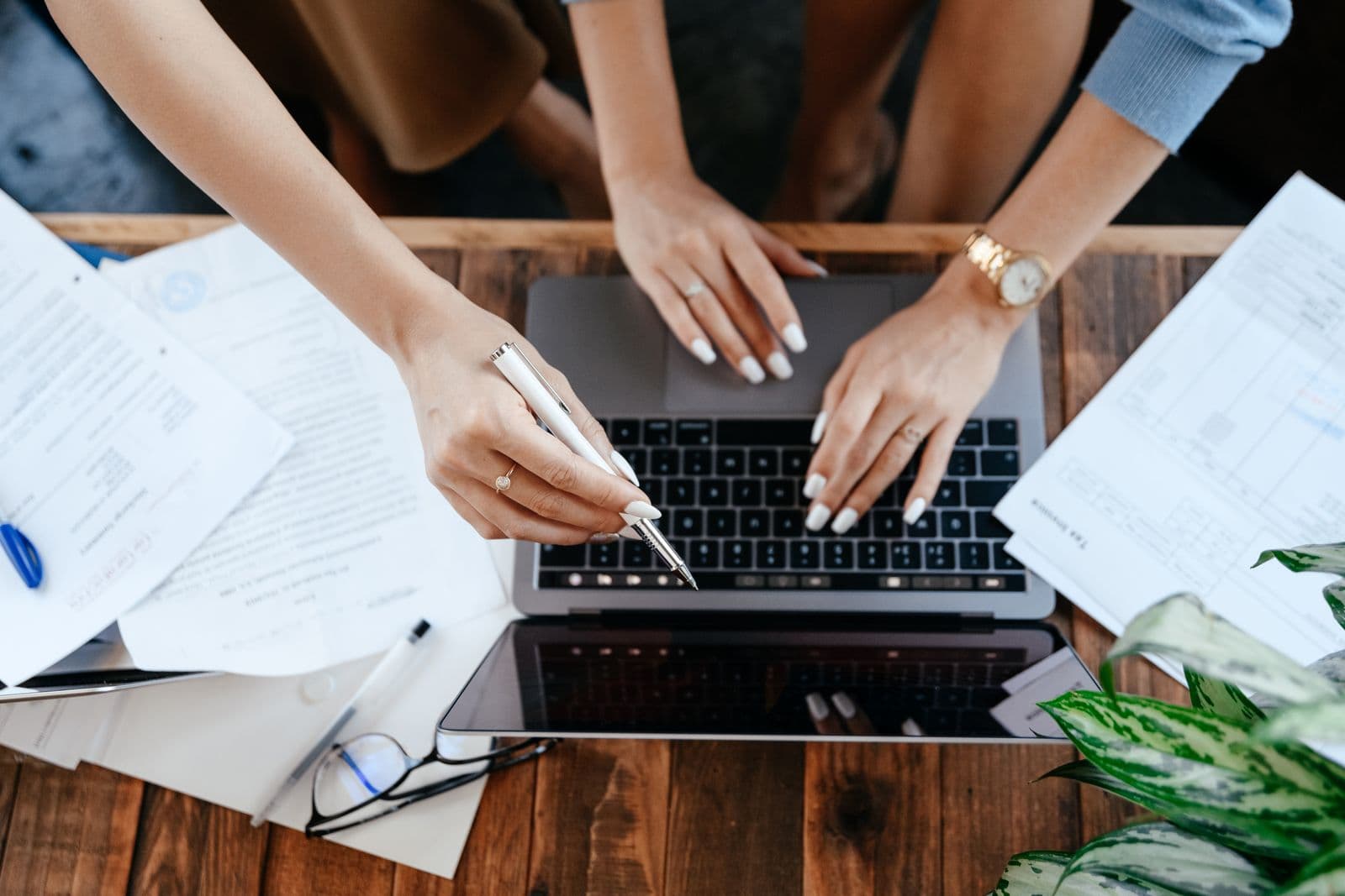 Two people working at a shared desk